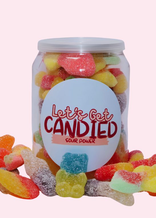 Jar of colorful candied gummy worms with 'Let's Get Candied' label on a pink background